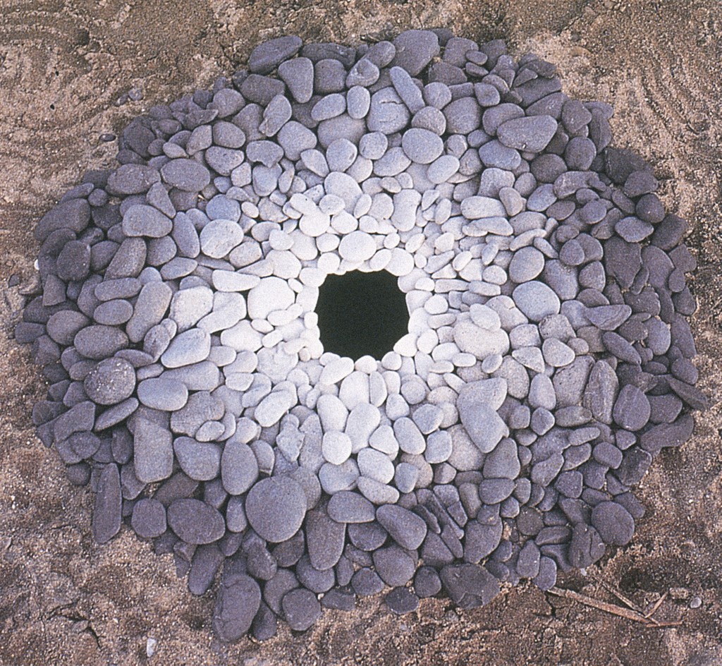 Pebbles arranged by color around a hole.  Creator Goldsworthy, Andy, 1956- Title Pebbles around a hole, Kinagashima-Cho, Japan Date Dec. 7, 1987 Material stones